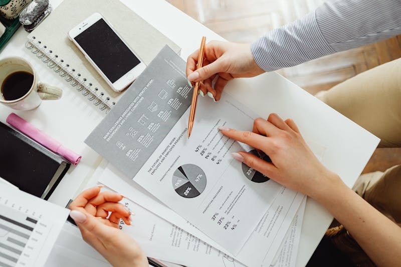 Financial advisor reviewing documents with client